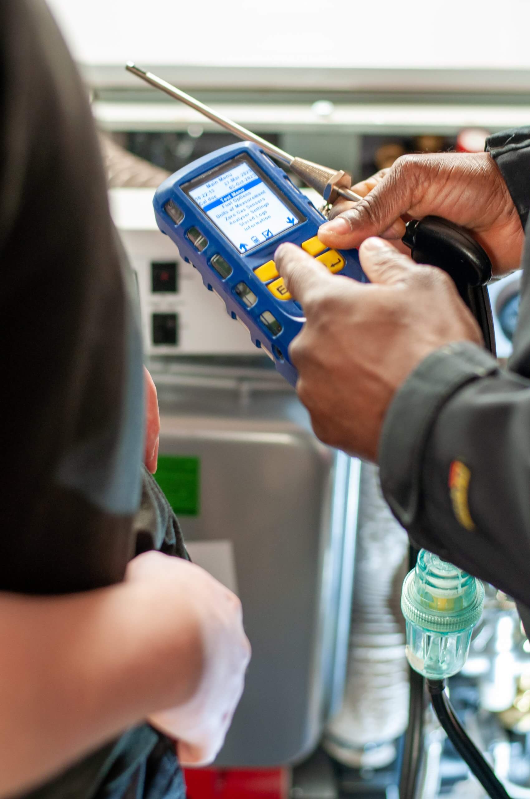 A boiler engineer using hand held device