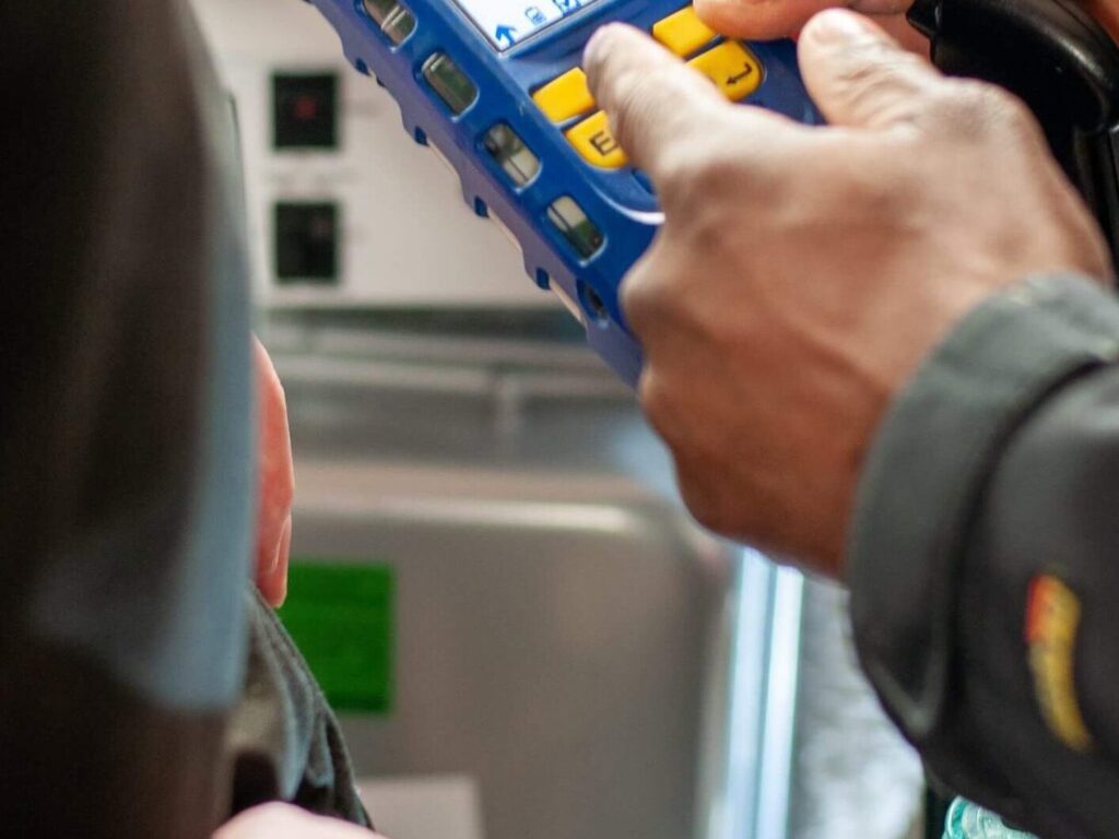 A boiler engineer using hand held device
